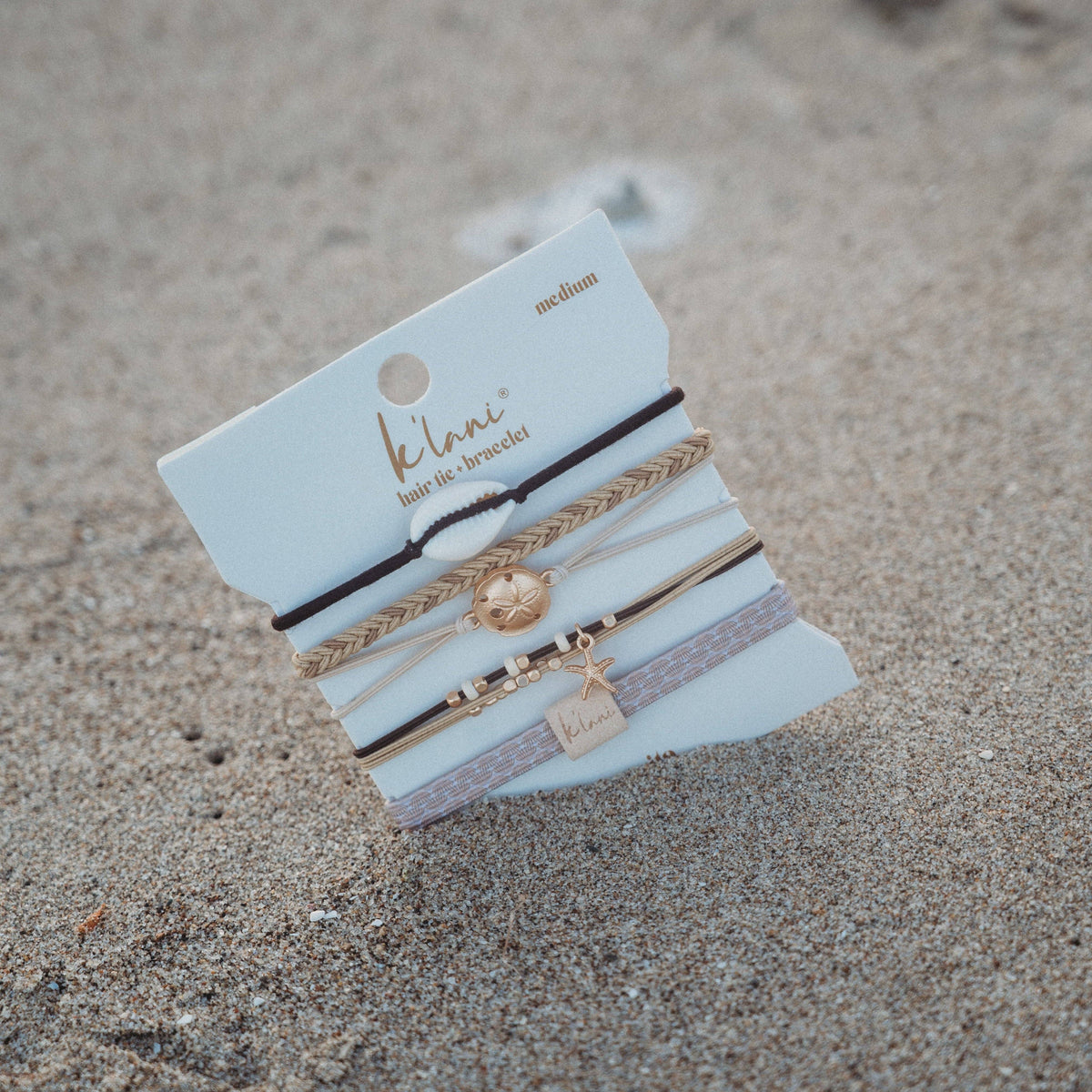 K'lani hair tie bracelets - "Radiant" Seashell Theme in Cream & Black Hair Tie Bracelets: Medium