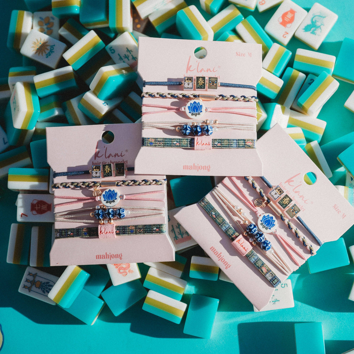 K'lani hair tie bracelets - "Mahjong" Themed in Pink, Green & Blue with Lotus & Tile Accent Hair Tie Bracelets: Medium
