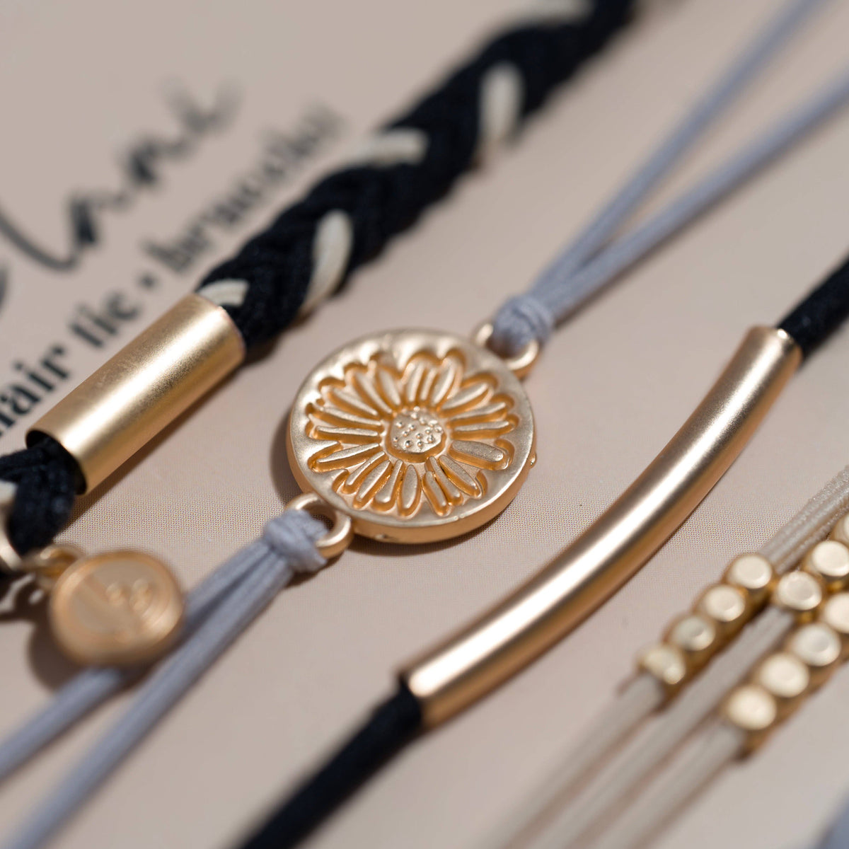 K'lani hair tie bracelets - "Inspire" Grey & Black with Gold Flower Accent Hair Tie Bracelets: Medium